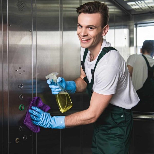 young-cleaning-company-worker-cleaning-elevator-and-smiling-at-camera.jpg young-cleaning-company-worker-cleaning-elevator-and-smiling-at-camera.jpg